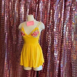 NWT ROMPER BY ALMOST FAMOUS in size small with embroidered applications on front